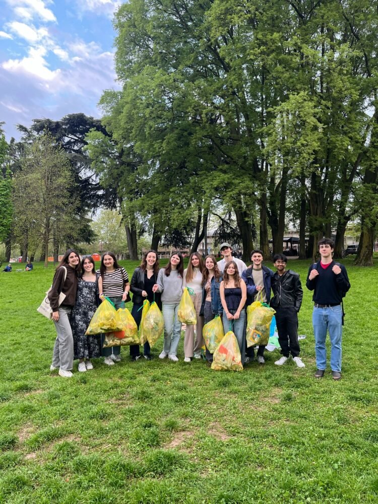 Members gathered under the trees in Parco Ravizza